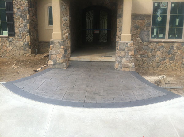 Stamped Entry Way with Stone Pillars